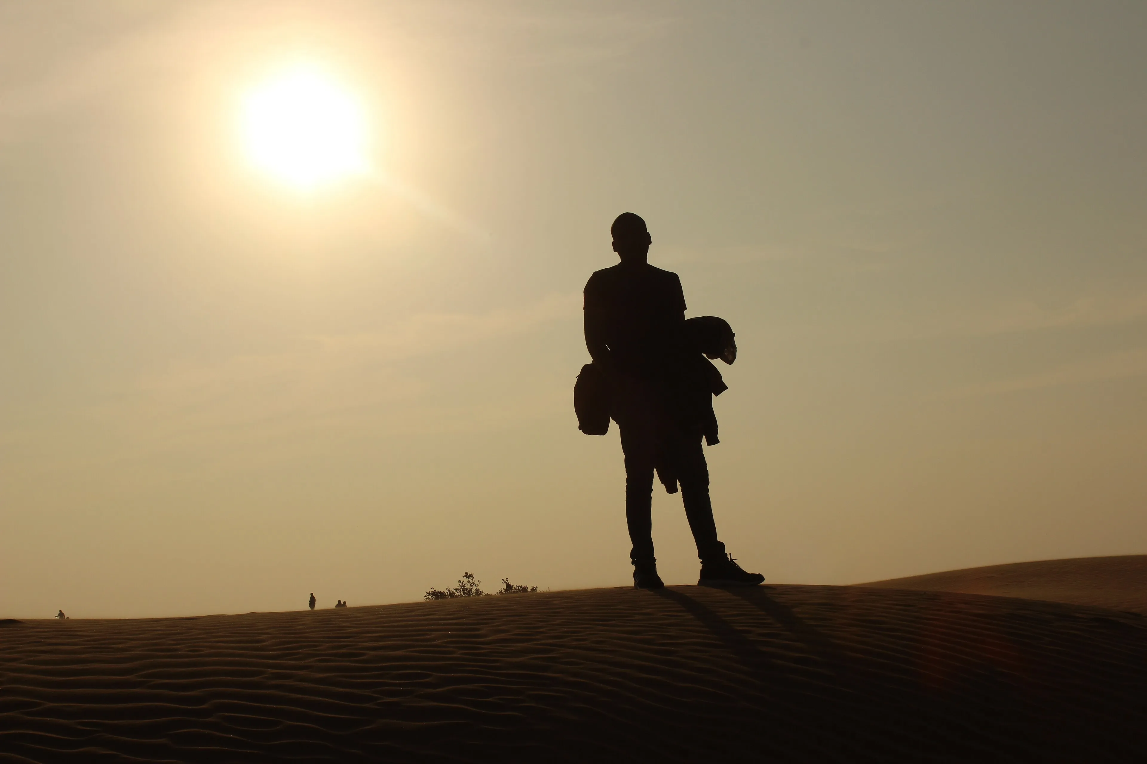 Traveller looking out over the Thar desert dunes near Jaisalmer